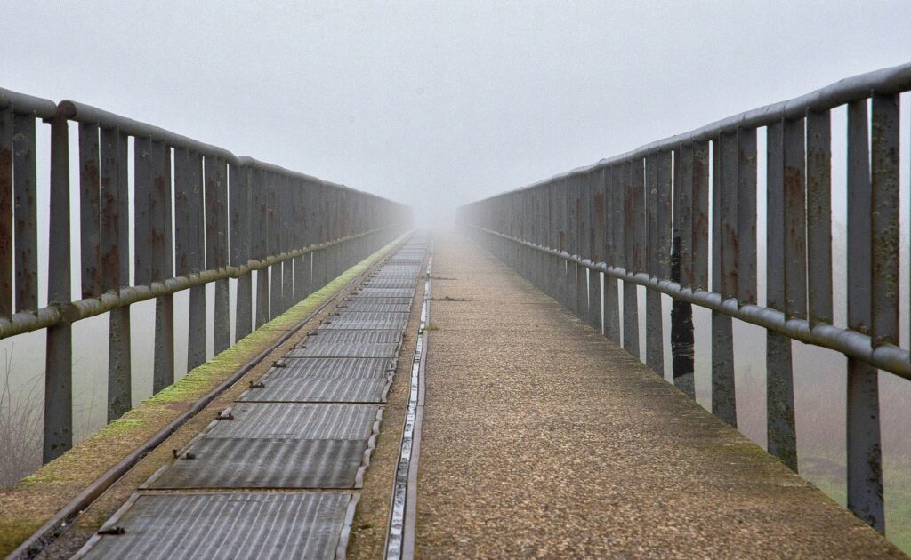 Bridge with high rails on either side.